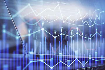 Forex graph hologram on table with computer background. Multi exposure. Concept of financial markets.