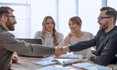handshake business people at a meeting in the office