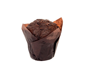 Chocolate muffin with sprinkles in brown food paper on white isolated background.