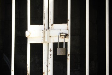 Padlock on metal door in Athens, Greece, March 14 2020.