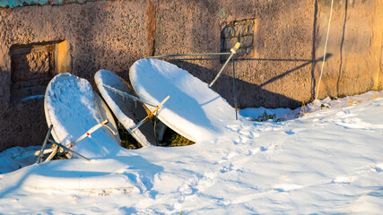 Satellite TV antennas in the snow