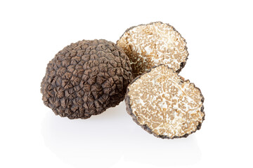 Black truffle and slices isolated on white, clipping path included