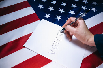 Woman putting tick on the paper for vote. Political changes in the country. Copy space place....
