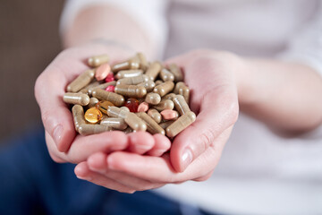 woman with different kinds of pills