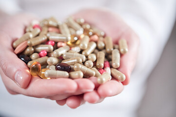woman with different kinds of pills