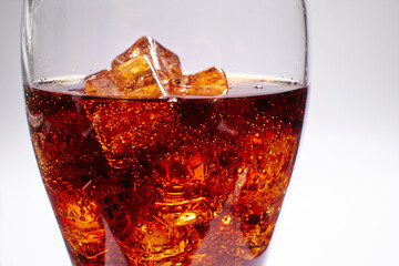 cola with ice cubes isolated