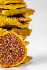 slices of dried figs on a white background. dried fruits. eco. macro.
