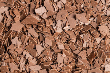 Grated dark chocolate. Chocolate flakes background.