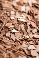 Grated dark chocolate. Chocolate flakes background.