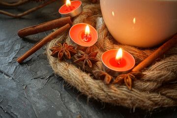 burning candles on a wooden background