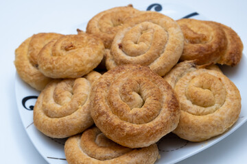 Sweet cinnamon rolls on a white plate