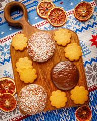 Christmas still life with homemade gingerbread cookies on wooden board