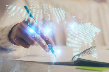 Social network theme hologram over woman's hands writing background. Concept of international...