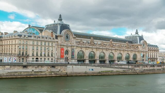 The musee d'Orsay is a museum in Paris timelapse, on the left bank of the Seine. View from Royal bridge. Musee d'Orsay has the largest collection of impressionist paintings in the world. Paris, France