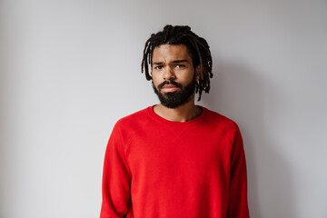 Serious african american man posing and looking at camera