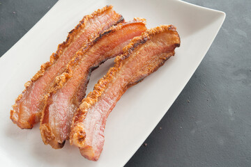 slice of bacon on plate