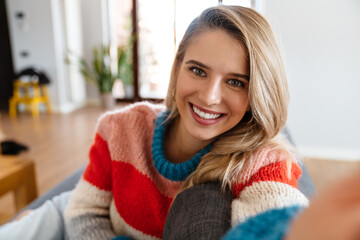 Beautiful young woman making a selfie