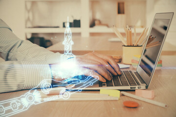Start up drawings with businessman working on computer on background. Teamwork concept. Double exposure.