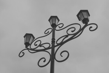 Forged lamp post, black and white photography