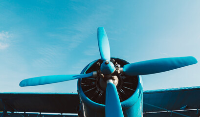 Engine and propeller of an airplane close up. Front of a propeller driven airplane. Single...