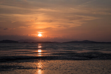 Fototapeta premium The mud flat where the sunset is reflected