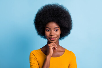 Photo of smart black girl volume hairdo look camera finger chin wear yellow shirt isolated blue...