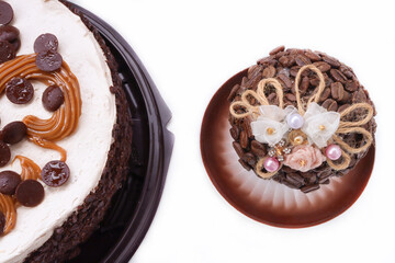 Cake and pastry with pieces of coffee on a white background. Cake and pastry with coffee beans