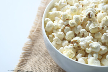  popcorn in a bowl on wooden desk