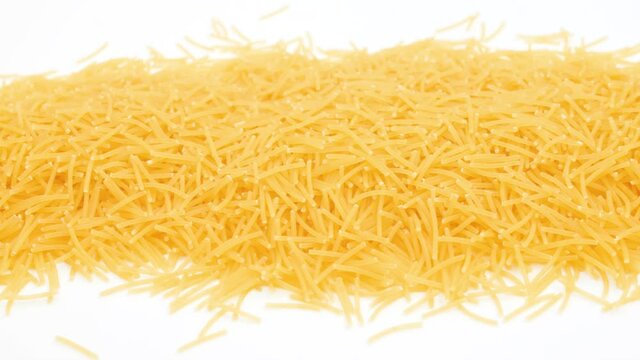 Top view of uncooked vermicelli pasta isolated on white