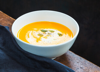 Pumpkin cream soup dark background copy space.