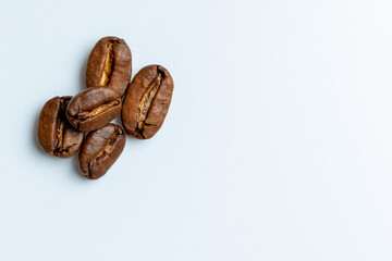 Coffee beans on white background.  Top view, macro photography with place for text.