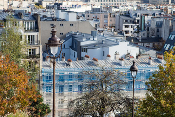 Closeup of street lights on roofs of Paris from Montmartre quarter background