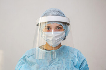 Fototapeta na wymiar young woman doctor nurse in a protective mask