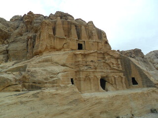 Hiking in the red sand dunes and cliffs of Wadi Rum and Petra archeological site in Jordan, Middle East