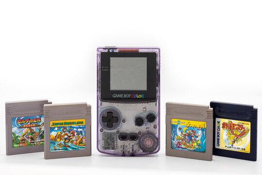 Fukuoka, Japan - june 23, 2019 : the famous nintendo game boy color portable console with some famous game cartridges
