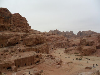 Hiking in the red sand dunes and cliffs of Wadi Rum and Petra archeological site in Jordan, Middle East