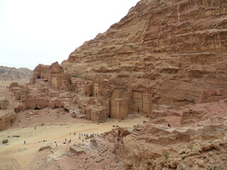 Hiking in the red sand dunes and cliffs of Wadi Rum and Petra archeological site in Jordan, Middle East