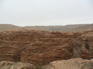Hiking in the red sand dunes and cliffs of Wadi Rum and Petra archeological site in Jordan, Middle East