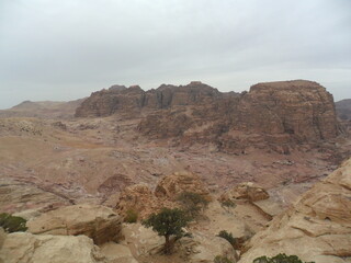 Hiking in the red sand dunes and cliffs of Wadi Rum and Petra archeological site in Jordan, Middle East