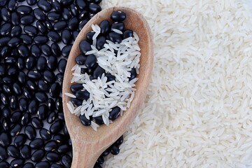 Raw white rice and black beans. Healthy food. 
