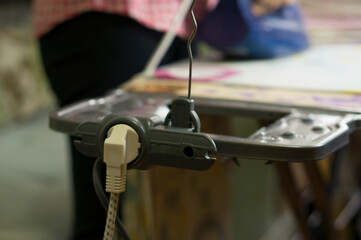 Ironing board socket for iron