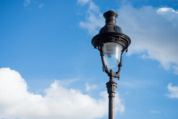 Closeup of street light  from Montmartre quarter in Paris on beautiful blue cloudy sky background