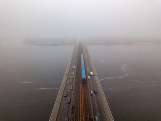Aerial drone view. Kiev metro bridge in dense fog.