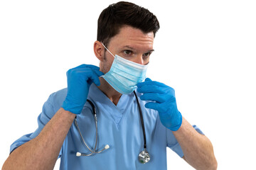 Male surgeon wearing face mask against white background