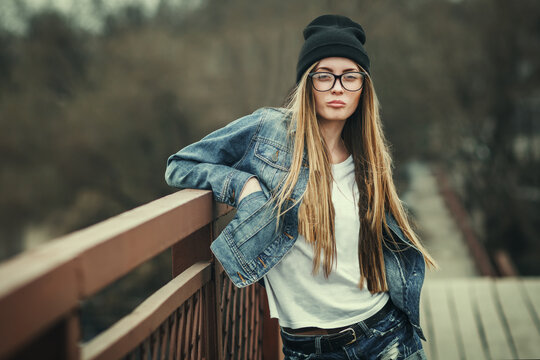 Outdoor Lifestyle Portrait Of Pretty Young Girl, Wearing In Hipster Swag Grunge Style Urban Background. Retro Vintage Toned Image, Film Simulation.