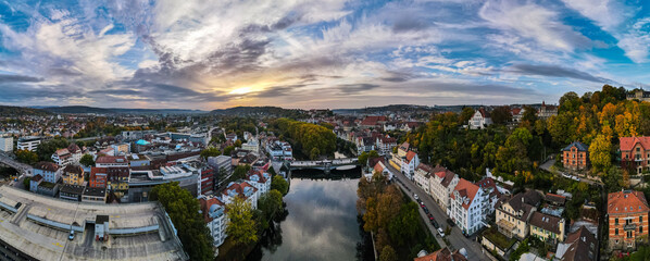 Aerial panorama of city center of Tübingen, reflection of evening sky in river Neckar. © Dominic