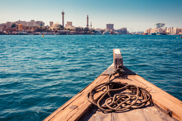 Panoramic view from traditional water taxi boats in Dubai, UAE. Creek gulf and Deira area. United...