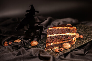 Cakes and pastries for Halloween celebration, holiday design with ghosts, bats and witchcraft potions on a black background. All saints' day confectionery.