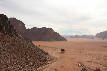 Fototapeta na wymiar Explring the red sand dunes and desert landscapes around Wadi Rum and Petra in Jordan, Middle East