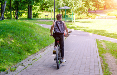 Fototapeta premium Cyclist ride on the bike path in the city Park 